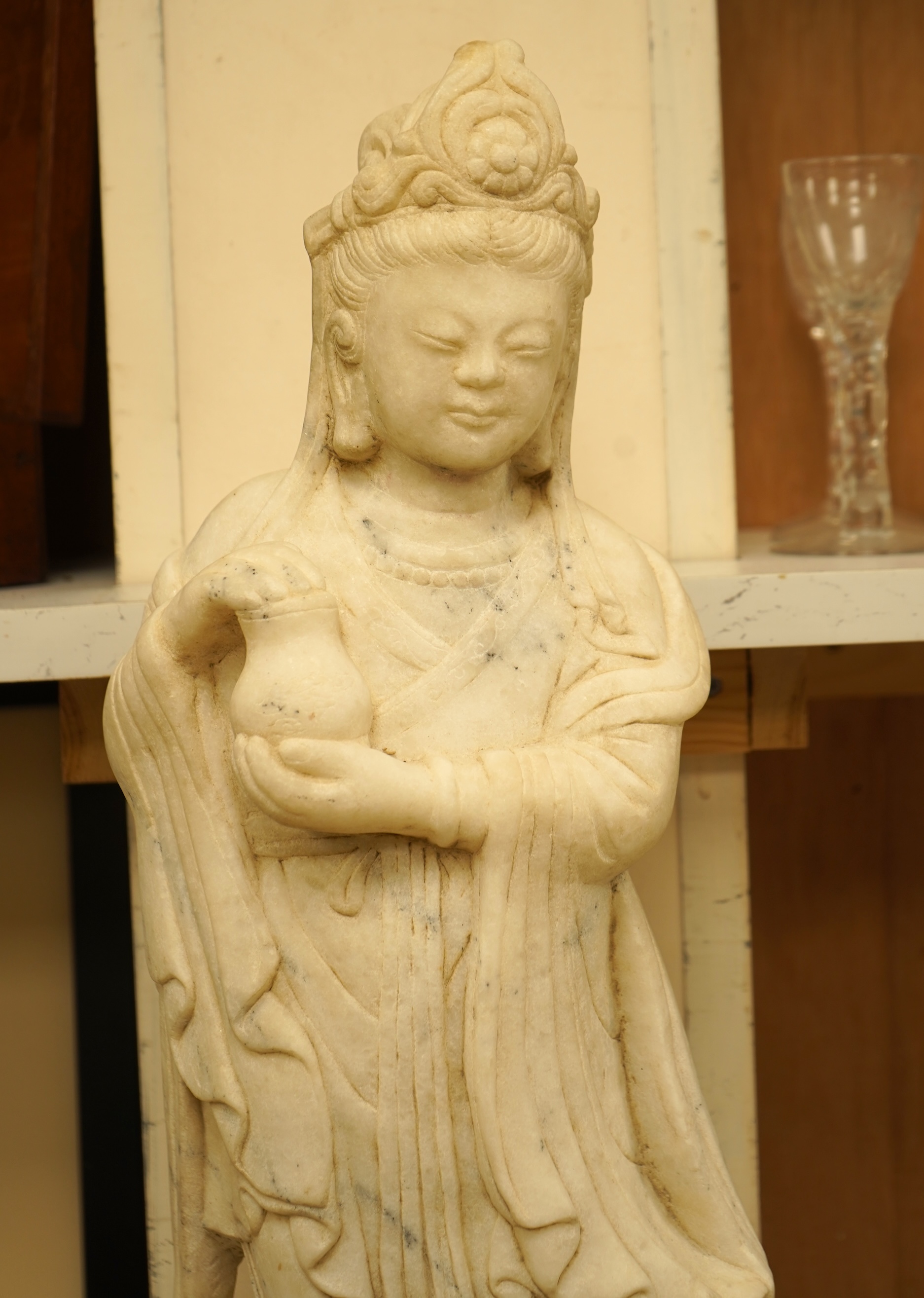 A large Chinese alabaster carving of Guanyin, 66cm high